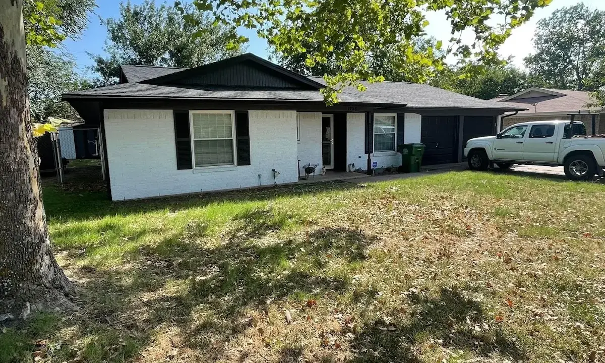 Professional roofing crew working on a residential roof in Kirkland